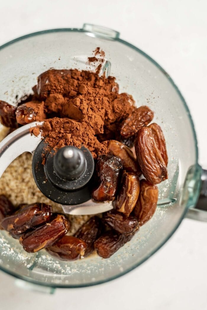 Dates, cocoa, coconut and walnuts in a food processor.