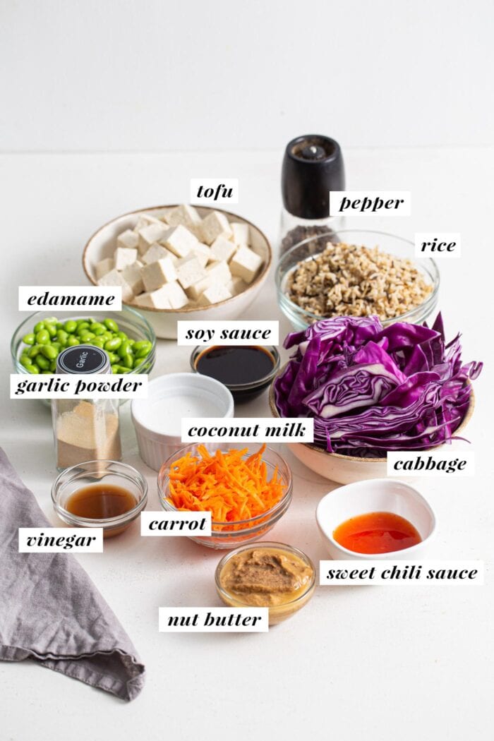 Labelled ingredients for making a tofu edamame buddha bowl.