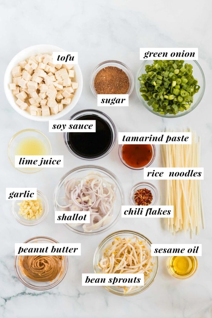 Visual list of ingredients for making a vegan tofu pad thai recipe. Each ingredient is labelled with text.