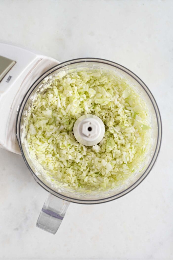 Finely chopped cabbage in a food processor.