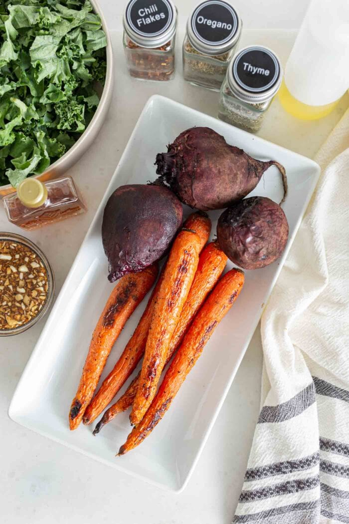 3 roasted beets and carrots on a serving platter.