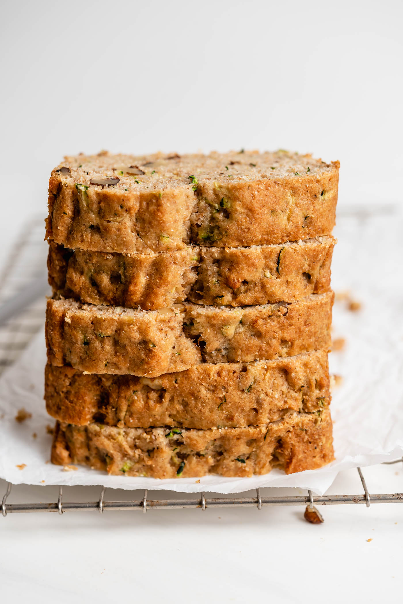 a stack of 5 thick slices of zucchini bread.