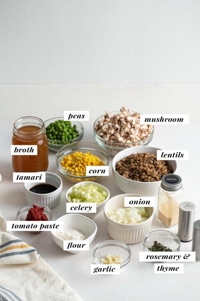 Visual list of ingredients for making lentil shepherds pie. Each ingredient labelled with text overlay.